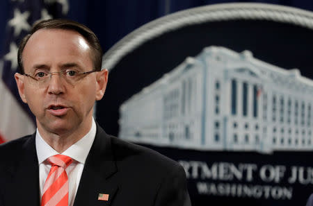 U.S. Deputy Attorney General Rod Rosenstein speaks at a news conference with other law enforcement officials at the Justice Department to announce nine Iranians charged with conducting massive cyber theft campaign, in Washington, U.S., March 23, 2018. REUTERS/Yuri Gripas