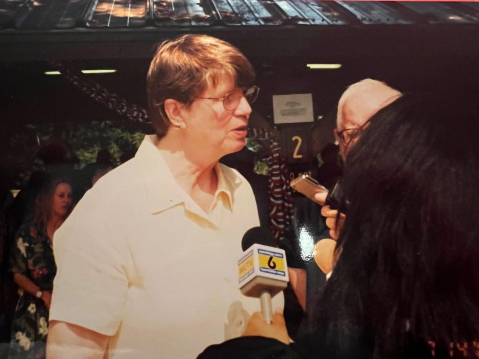 Janet Reno speaks with reporters at the first barbecue and rally organized by local Democrats in 2001.