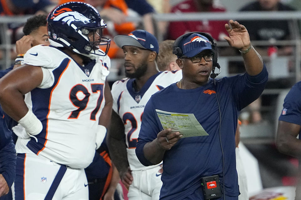 Denver Broncos defensive coordinator Vance Joseph, right, gestures from the sideline during the second half of an NFL preseason football game against the Arizona Cardinals in Glendale, Ariz., Friday, Aug. 11, 2023. (AP Photo/Matt York)