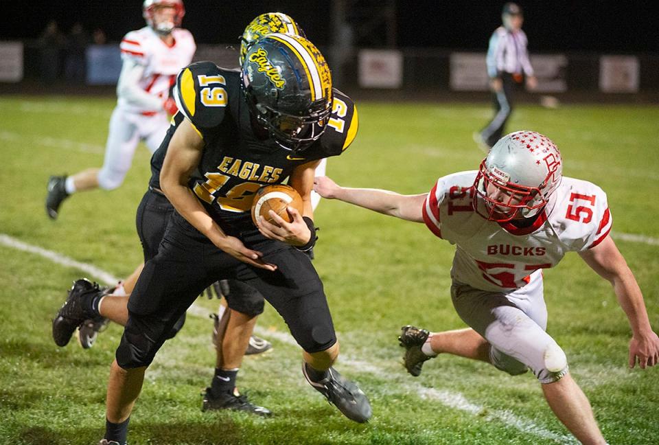 Colonel Crawford's Ryan McMichael shakes off Buckeye Central's Landon Sherwood.