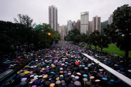 Anti-extradition bill protesters march to demand democracy and political reforms, in Hong Kong