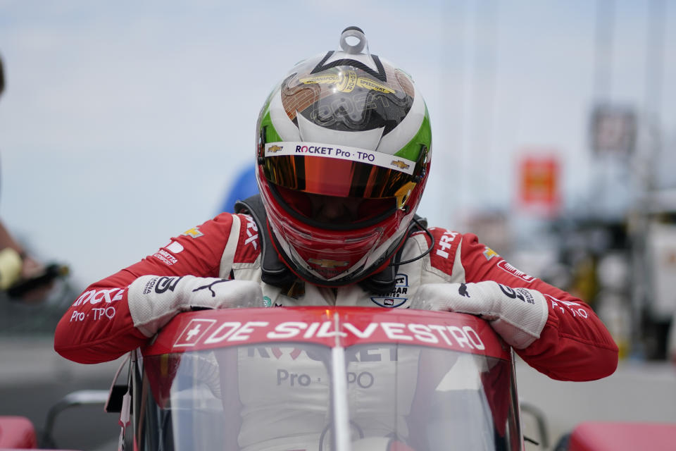 Simona De Silvestro, of Switzerland, climbs out of her car during qualifications for the Indianapolis 500 auto race at Indianapolis Motor Speedway, Saturday, May 22, 2021, in Indianapolis. (AP Photo/Darron Cummings)