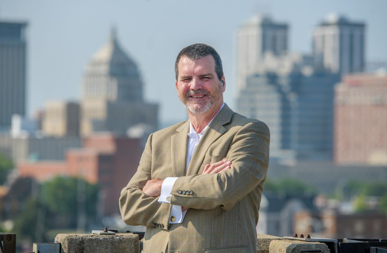 The Peoria skyline fills the scene behind Michael Freilinger, president and CEO of the Downtown Development Corporation of Peoria.