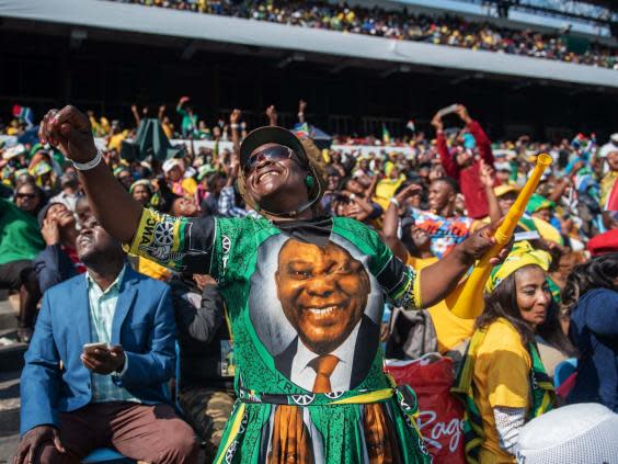 ANC supporter celebrates Ramaphosa's inauguration ceremony (AFP/Getty Images)