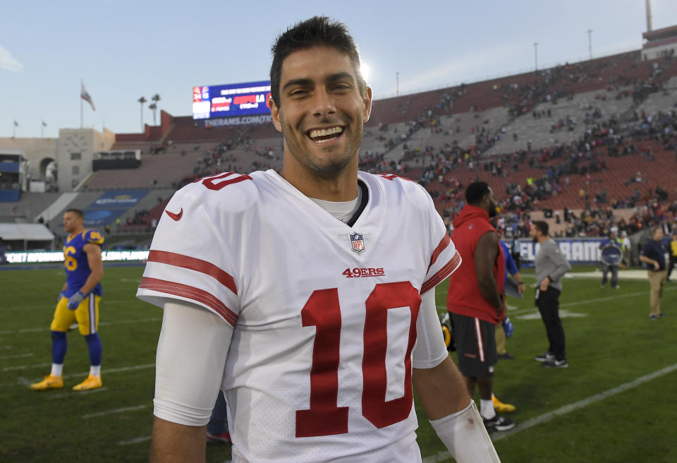 Smile, you’re about to get free money: 49ers QB Jimmy Garoppolo may receive playoff bonus money from his former team, the Patriots. (AP)