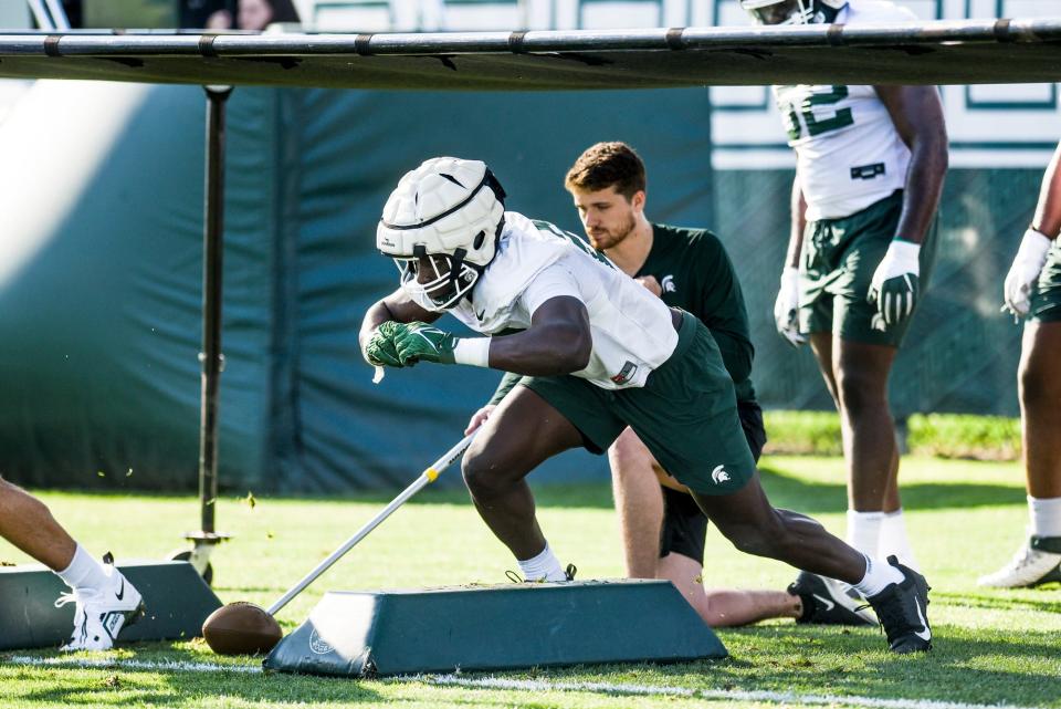 Michigan State defensive end Bai Jobe runs a drill during the opening day of MSU's football fall camp on Thursday, Aug. 3, 2023, in East Lansing.