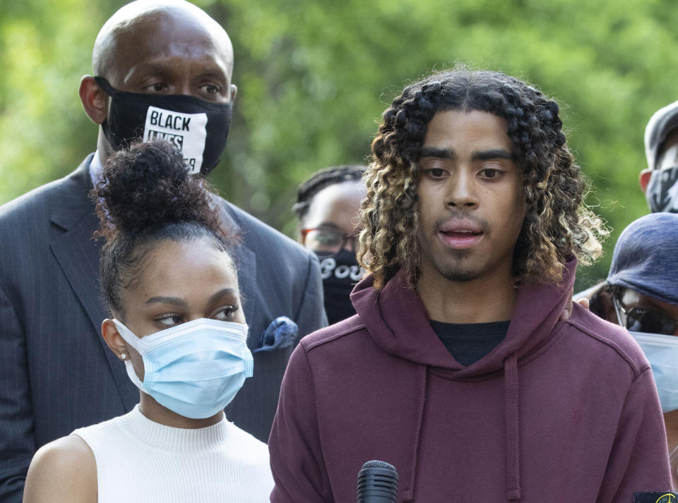 FILE - Taniyah Pilgrim, left, stands with Messiah Young, right, as he speaks during a news conference on the campus of Morehouse College, June 1, 2020, in Atlanta. On Monday, July 1, 2024, the Atlanta City Council approved the payment of a settlement of $2 million to the two college students who were shocked with Tasers and pulled from a car while they were stuck in downtown traffic caused by protests over George Floyd's killing. (AP Photo/John Bazemore, File)