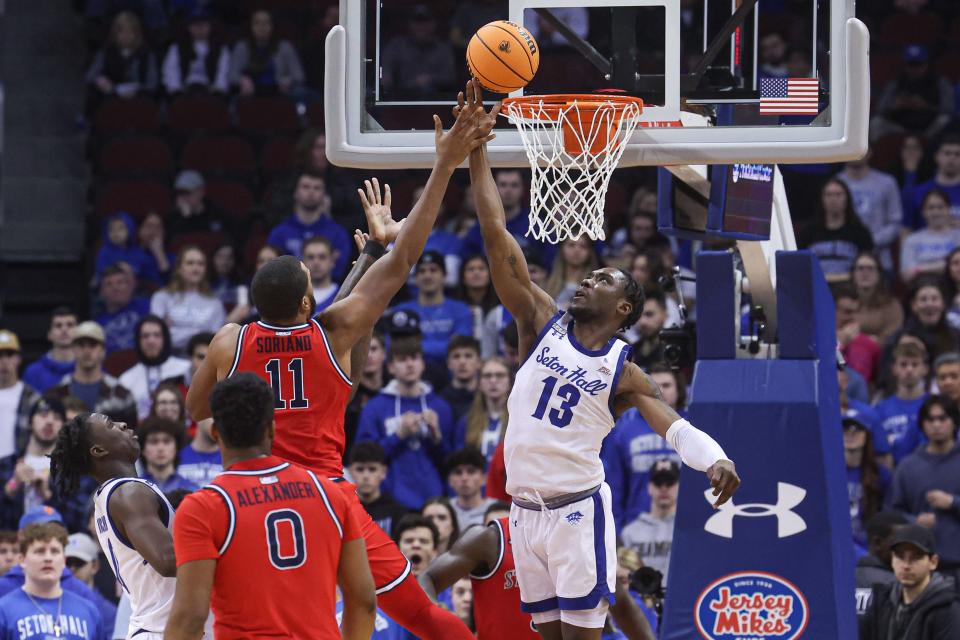 Seton Hall Pirates forward KC Ndefo (13) blocks a shot by St. John's Red Storm center Joel Soriano (11) during the second half at Prudential Center.