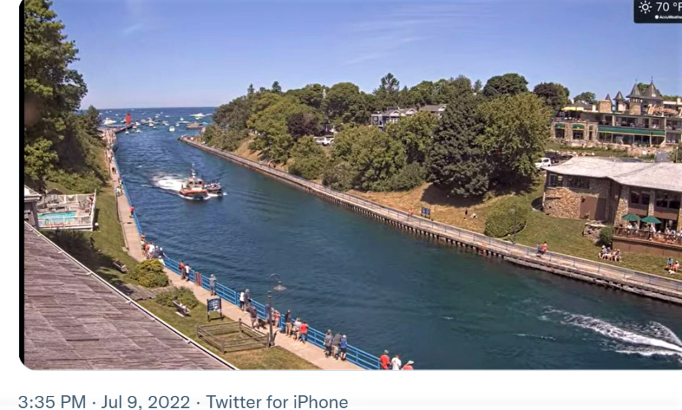 A pontoon boat is escorted through Charlevoix's channel after taking on water in Lake Michigan. The U.S. Coast Guard Great Lakes notified the public of the event via Twitter on July 9, the day of the Boyne Thunder Poker Run.