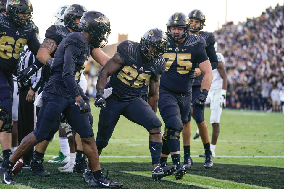 Purdue running back King Doerue (22) celebrates a touchdown during the second half of the team's NCAA college football game against Michigan State in West Lafayette, Ind., Saturday, Nov. 6, 2021. Purdue won 40-29. (AP Photo/Michael Conroy)