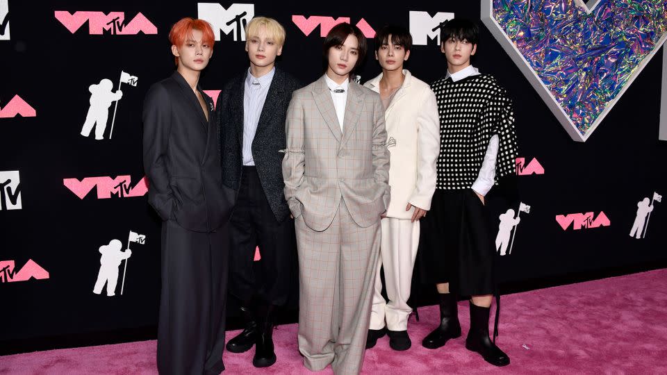 South Korean boy band Tomorrow x Together, attending their first VMAs, looked dapper in a variety of black, white and tan looks. 
  - Evan Agostini/Invision/AP