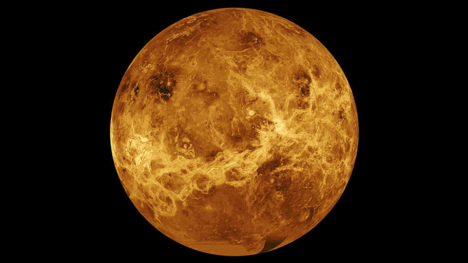 An image of fiery Venus against space.