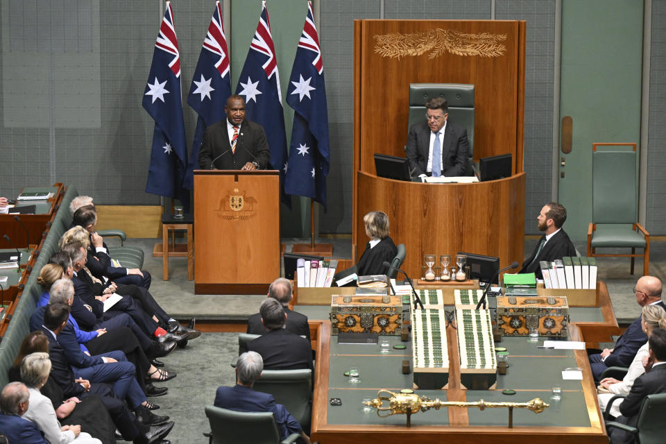 Papua New Guinea's Prime Minister James Marape, top left, addresses members and senators in the House of Representatives at Parliament House in Canberra, Australia, Thursday, Feb. 8, 2024. (Mick Tsikas/AAP Image via AP)