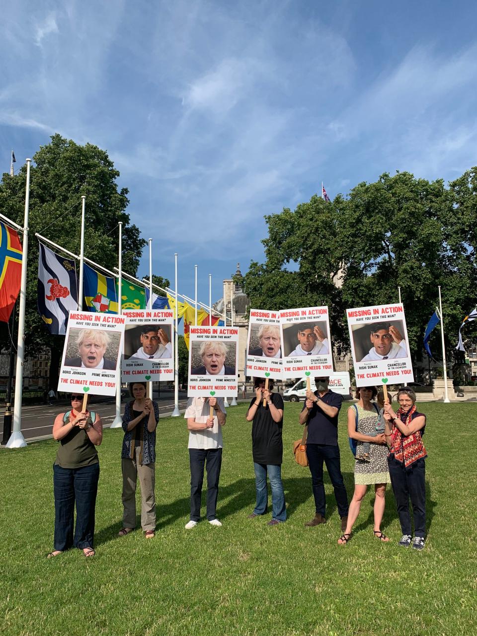 Placards questioning the whereabouts of Johnson and Sunak in the fight against climate change filled the patch of grass outside Westminster (Sam Hancock)