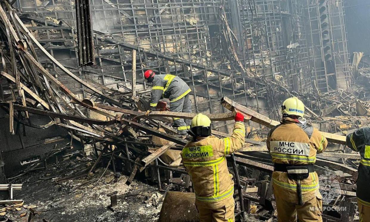 <span>Rescuers working inside Crocus City Hall, a day after a attack in Krasnogorsk, outside Moscow</span><span>Photograph: Russian emergency ministry/AFP/Getty Images</span>