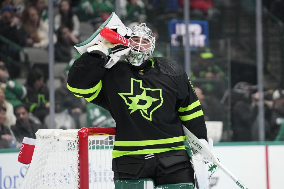 Dallas Stars goaltender Jake Oettinger takes a sip of water in the second period of an NHL hockey game against the San Jose Sharks in Dallas, Friday, Nov. 11, 2022. (AP Photo/Tony Gutierrez)