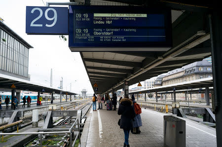 Stranded commuters wait for trains during a rail workers' strike across the country due to a pay dispute with Deutsche Bahn in Munich, Germany December 10, 2018. REUTERS/Martin Hangen