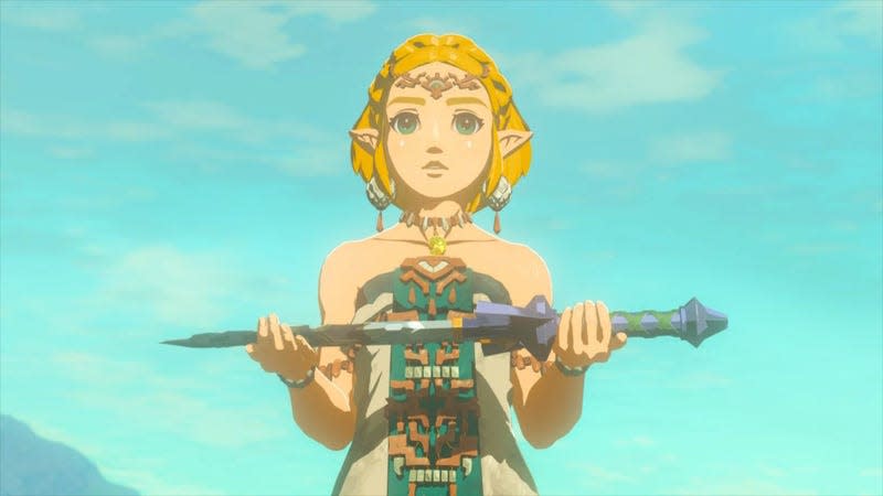 Zelda holds the master sword.