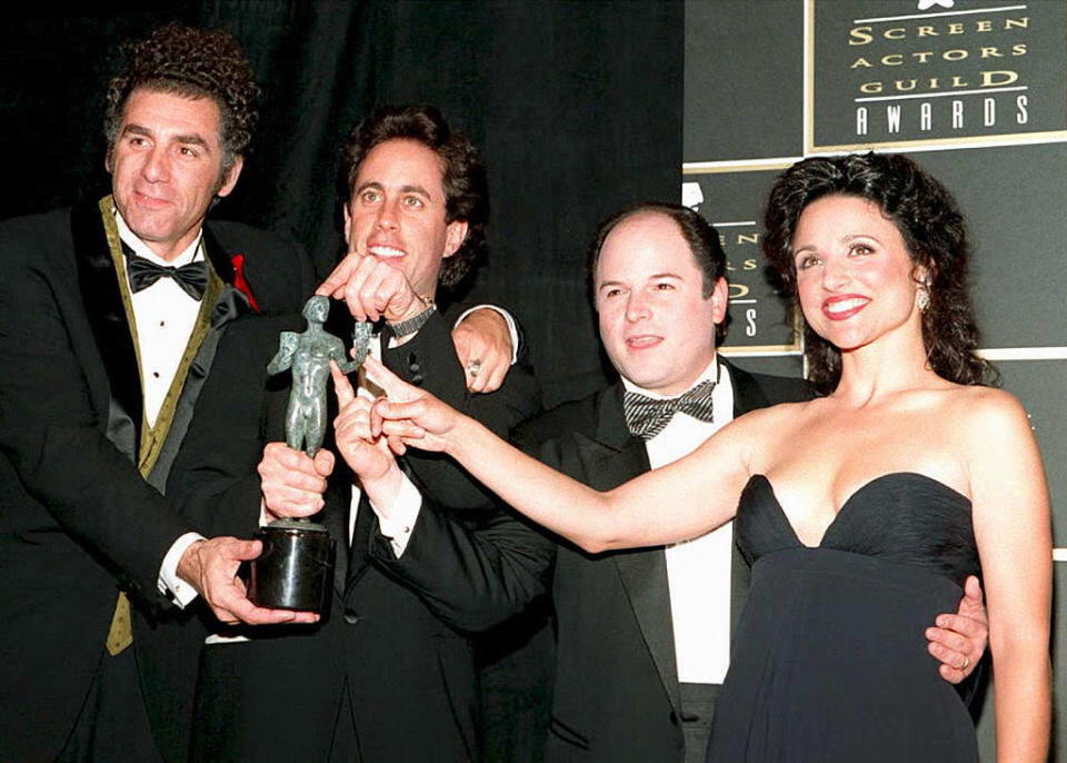 "Seinfeld" stars Michael Richards, Jerry Seinfeld, Jason Alexander and Julia Louis-Dreyfus celebrate their award for outstanding ensemble in a comedy series at the Screen Actors Guild Awards on Feb. 25, 1995, in Los Angeles. (Photo: Vince Bucci/AFP/Getty Images)