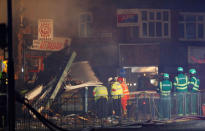 Members of the emergency services work at the site of an explosion which destroyed a convenience store and a home in Leicester, Britain, February 25, 2018. REUTERS/Darren Staples