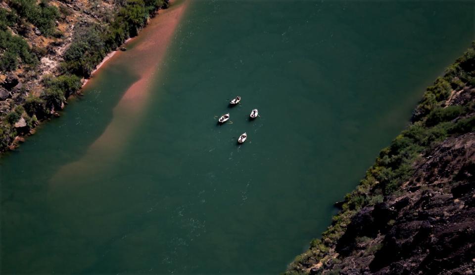 Whitewater river rafters on the Colorado River as seen from Toroweap Overlook on the north rim of the Grand Canyon.