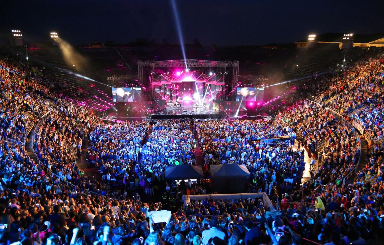 Verona, VR, Italy - June 5, 2017: Live concert inside the Ancient Roman Arena with many people and stage