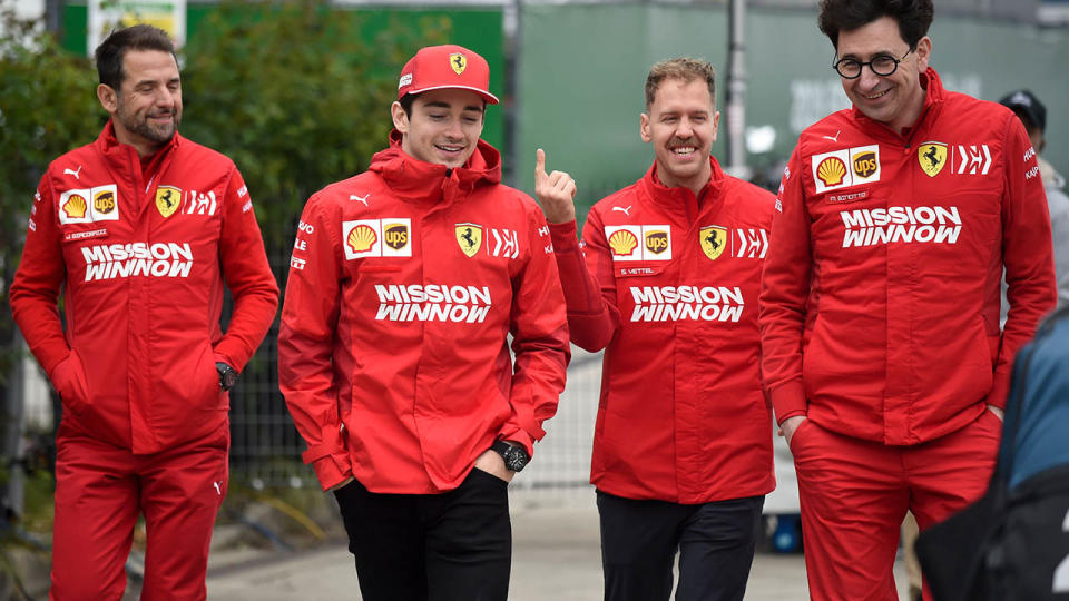 Charles Leclerc and Sebastian Vettel with team bosses. (Photo by WANG ZHAO/AFP/Getty Images)