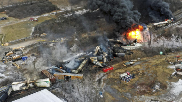 An aerial view of a Norfolk Southern freight train that derailed the previous night in East Palestine, Ohio, still on fire.