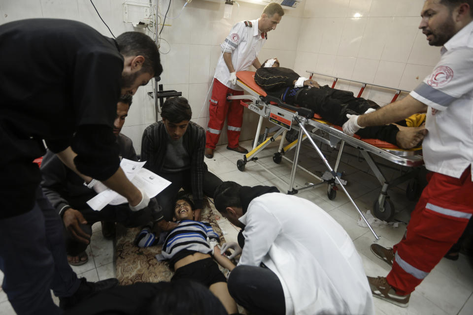 Palestinians wounded in the Israeli bombardment of the Gaza Strip receive treatment at the hospital in Khan Younis, Gaza Strip, on Wednesday, Dec. 27, 2023. (AP Photo/Mohammed Dahman)