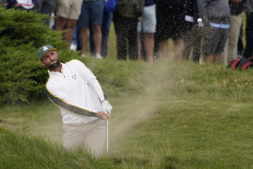 Team Europe's Jon Rahm hits from a bunker on the first hole during a practice day at the Ryder Cup at the Whistling Straits Golf Course Wednesday, Sept. 22, 2021, in Sheboygan, Wis. (AP Photo/Jeff Roberson)