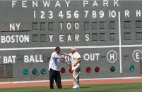 BOSTON, MA - APRIL 20: Carl Yazstremski and Jim Rice, former Boston Red Sox players, shake hands during 100 Years of Fenway Park activities before a game between the Boston Red Sox and the New York Yankees at Fenway Park April 20, 2012 in Boston, Massachusetts. (Photo by Jim Rogash/Getty Images)
