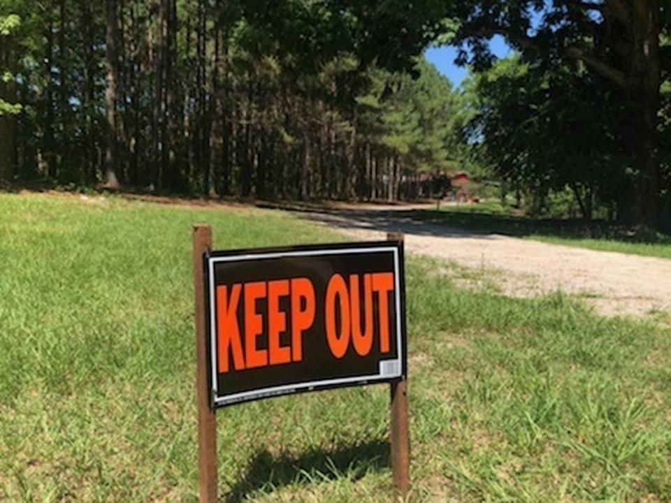 A “KEEP OUT” sign freshly put in the grass outside of the Murdaugh home in Colleton County.