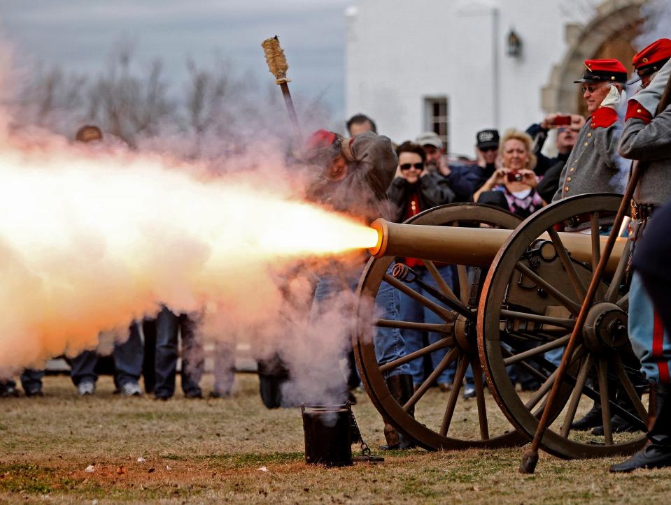 A light 6-pounder gun on a prairie carriage is fired Dec. 19, 2011, during the annual Christmas Guns Celebration at Fort Reno in El Reno.