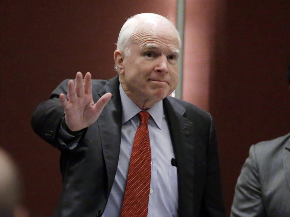 FILE - In this June 3, 2016, file photo, Sen. John McCain, R-Ariz., greets the audience as he arrives to deliver a speech in Singapore. McCain, the war hero who became the GOP's standard-bearer in the 2008 election, died Saturday, Aug. 25, 2018. He was 81. (AP Photo/Wong Maye-E, File)