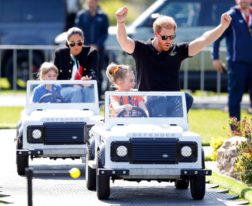 THE HAGUE, NETHERLANDS - APRIL 16: (EMBARGOED FOR PUBLICATION IN UK NEWSPAPERS UNTIL 24 HOURS AFTER CREATE DATE AND TIME) Meghan, Duchess of Sussex and Prince Harry, Duke of Sussex accompany young children driving mini Land Rover Defenders at the Land Rover Driving Challenge, on day 1 of the Invictus Games 2020 at Zuiderpark on April 16, 2022 in The Hague, Netherlands. (Photo by Max Mumby/Indigo/Getty Images)