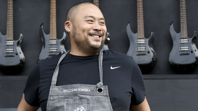 David Chang wearing an apron