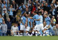 Manchester City's Gabriel Jesus, center, celebrates with teammates after scoring a disallowed goal during the English Premier League soccer match between Manchester City and Tottenham Hotspur at Etihad stadium in Manchester, England, Saturday, Aug. 17, 2019. (AP Photo/Rui Vieira)