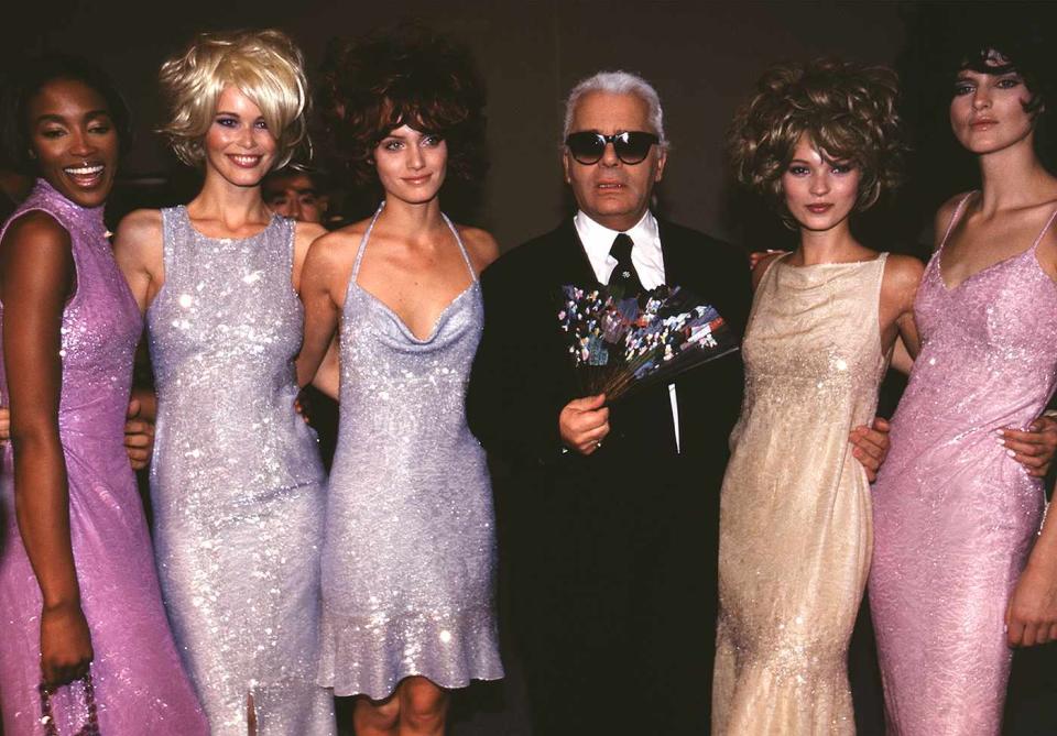 <p>As creative director of Chanel, the late Karl Lagerfeld was always surrounded by the industry's top faces: here, the late designer posed with Naomi Campbell, Claudia Schiffer, Amber Valletta, Kate Moss and Stella Tennant at the Chanel ready-to-wear Spring/Summer 1996/1997 show in Paris. </p>