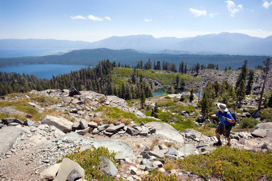 A hiker peers back toward Fallen Leaf Lake as he makes his way up the trail to the summit of Mt. Tallac on July 31, 2013, in Lake Tahoe.