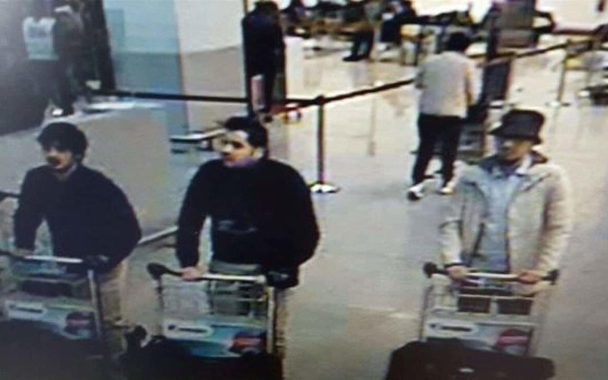  In this image provided by the Belgian Federal Police in Brussels on Tuesday, March 22, 2016, three men who are suspected of taking part in the attacks at Belgium's Zaventem Airport and are being sought by police. The men on both the left and right are yet unidentified, the man at center has been the identified by the Federal Prosecutors office on Wednesday, March 23, 2016 as Ibrahim El Bakraoui - Belgian Federal Police via AP