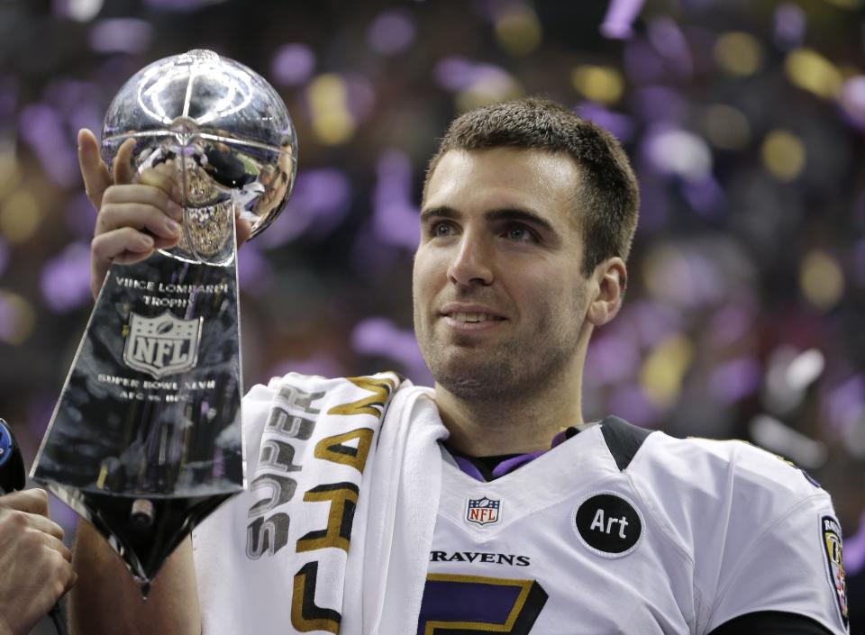 FILE - In this Feb. 13, 2013 file photo, Baltimore Ravens quarterback Joe Flacco (5) holds the Vince Lombardi Trophy after defeating the San Francisco 49ers 34-31 in the NFL Super Bowl XLVII football game in New Orleans. Flacco was the Super Bowl MVP and the NFL's highest-paid quarterback just a few years ago. After injuries shortened his last two seasons, Flacco is now in New York with a new role: as a backup to Sam Darnold. (AP Photo/Matt Slocum, File)