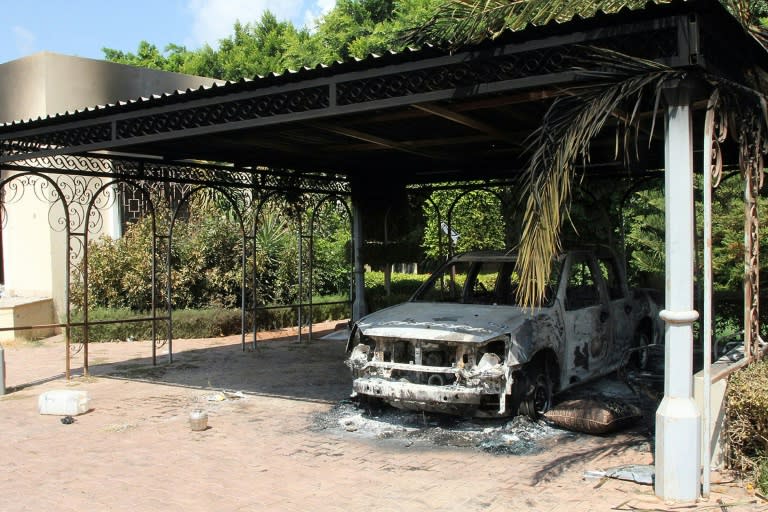 The wreckage of a car sits inside the US Embassy compound in Benghazi, Libya, on September 12, 2012 following an overnight attack on the building