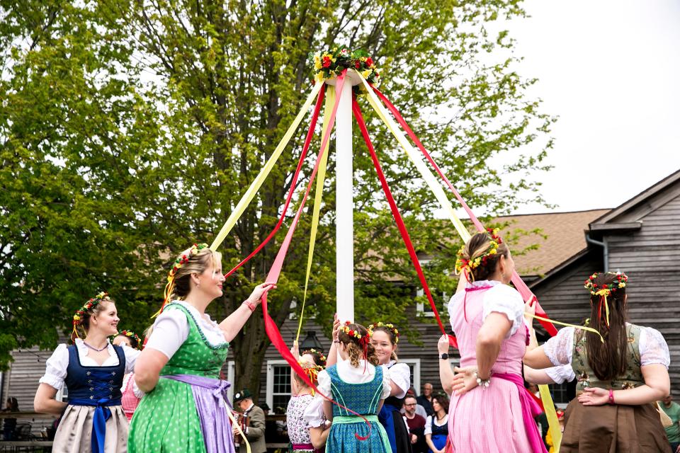 Maipole Dancers perform during Maifest, Saturday, May 6, 2023, outside Millstream Brau Haus in Amana, Iowa.