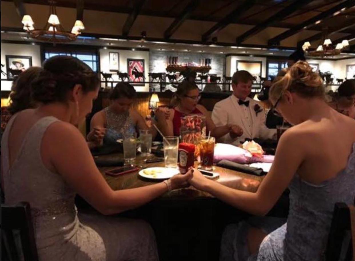 A photo of teens praying on prom night has sparked controversy. (Photo: Facebook/Frank Somerville)