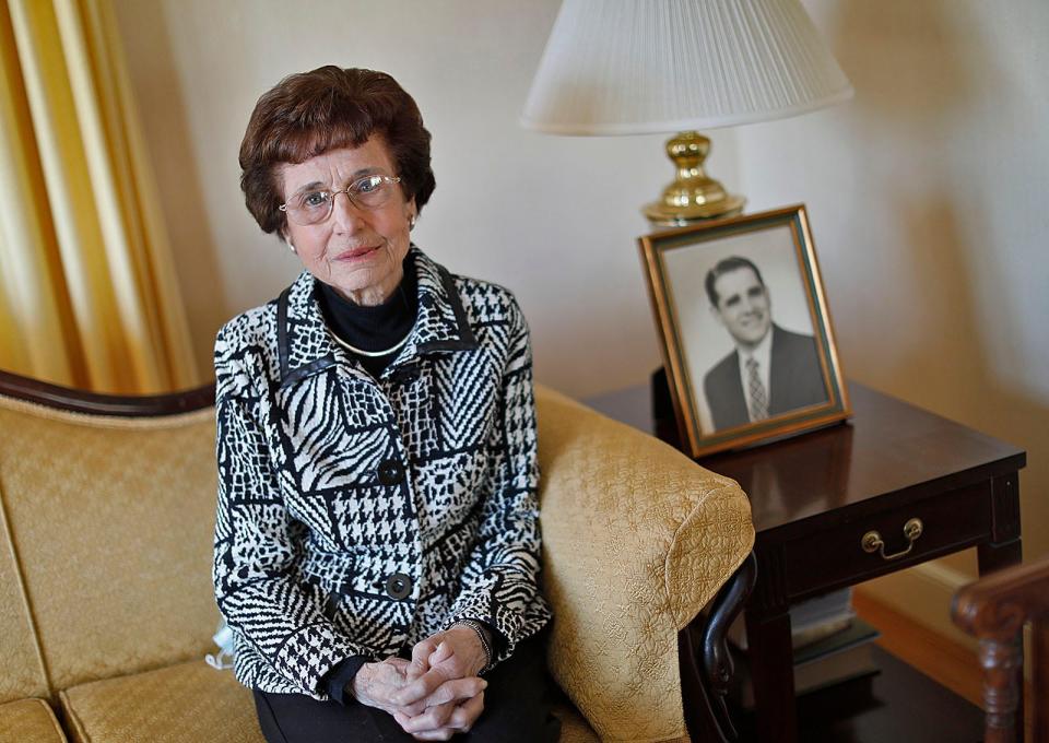 Marguerite 'Peg' Fasino, 92, beside a photograph of her late husband, James, a lawyer in Weymouth. She developed the town of Weymouth's first English as a Second Language program in the 1980s and 1990s.