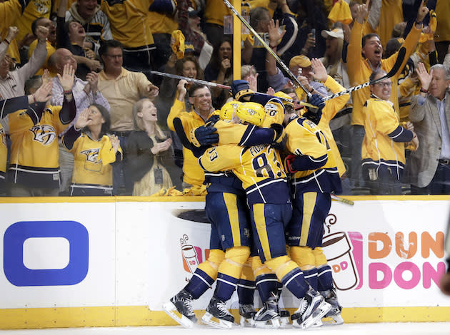 Nashville Predators players celebrate after scoring a goal against the Anaheim Ducks in the third period of Game 6 of the Western Conference final in the NHL hockey Stanley Cup playoffs Monday, May 22, 2017, in Nashville, Tenn. The Predators won 6-3 to win the series 4-2 and advance to the Stanley Cup Finals. (AP Photo/Mark Humphrey)
