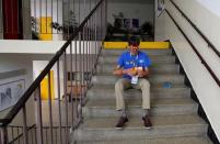 A blindfolded competitor solves a Rubik's cube as he prepares for the Rubik's Cube European Championship in Prague, Czech Republic, July 15, 2016. Picture taken July 15, 2016. REUTERS/David W Cerny