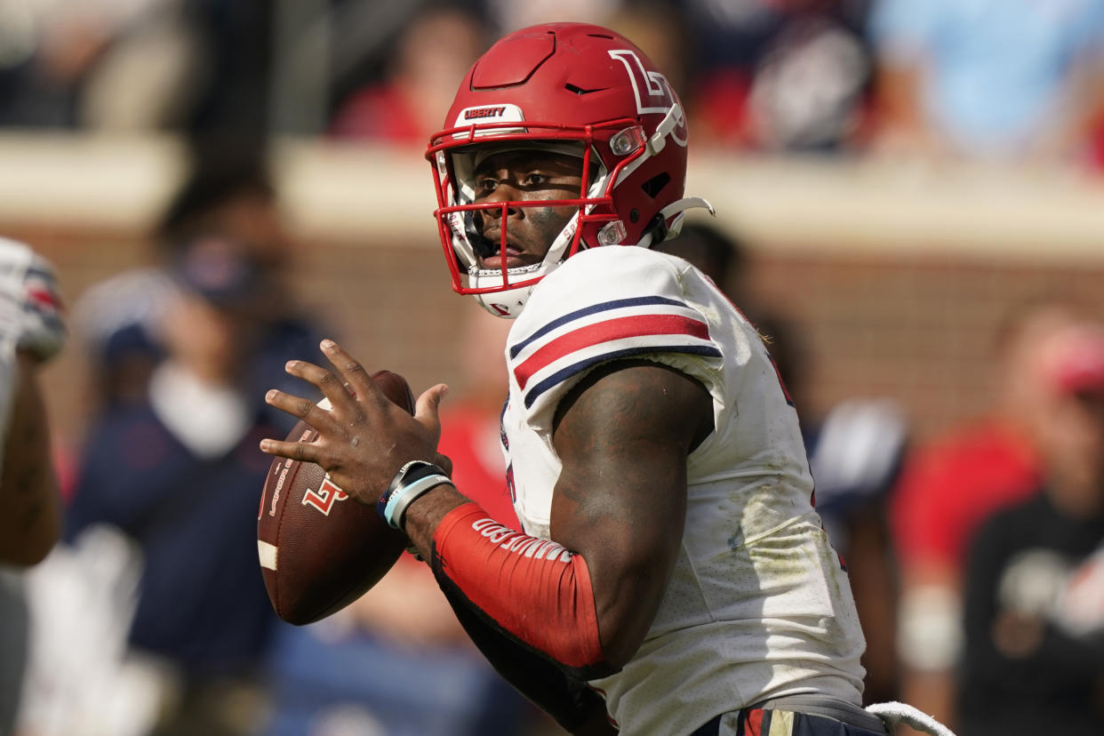 Could Liberty quarterback Malik Willis end up as Russell Wilson's long-term replacement? (AP Photo/Rogelio V. Solis, File)