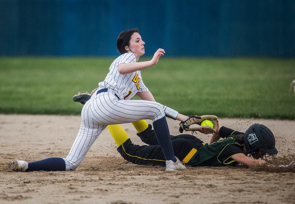 Delta's Shelby White attempts and out at second against Northeastern during their game at Delta High School Tuesday April 12, 2022. 
