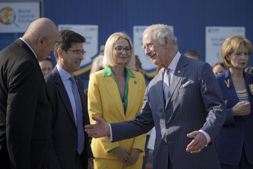 Britain's Prince Charles gestures after visiting a center for refugees fleeing the war in neighboring Ukraine, at the Romexpo convention center, in Bucharest, Romania, Wednesday, May 25, 2022. (AP Photo/Vadim Ghirda)